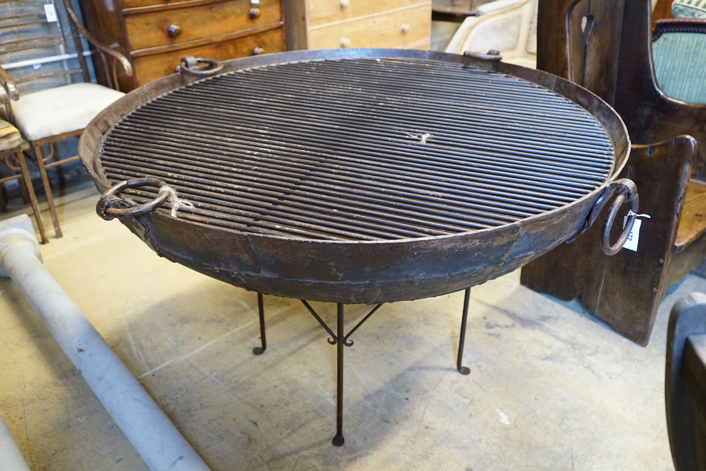 A wrought iron fire pit, diameter 61cm height 57cm